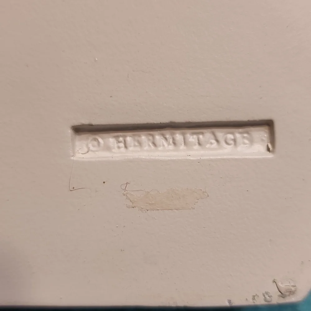 Hermitage off white poly resin floral shelf